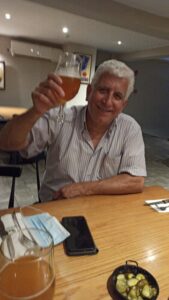 Zohar raising a glass with guests